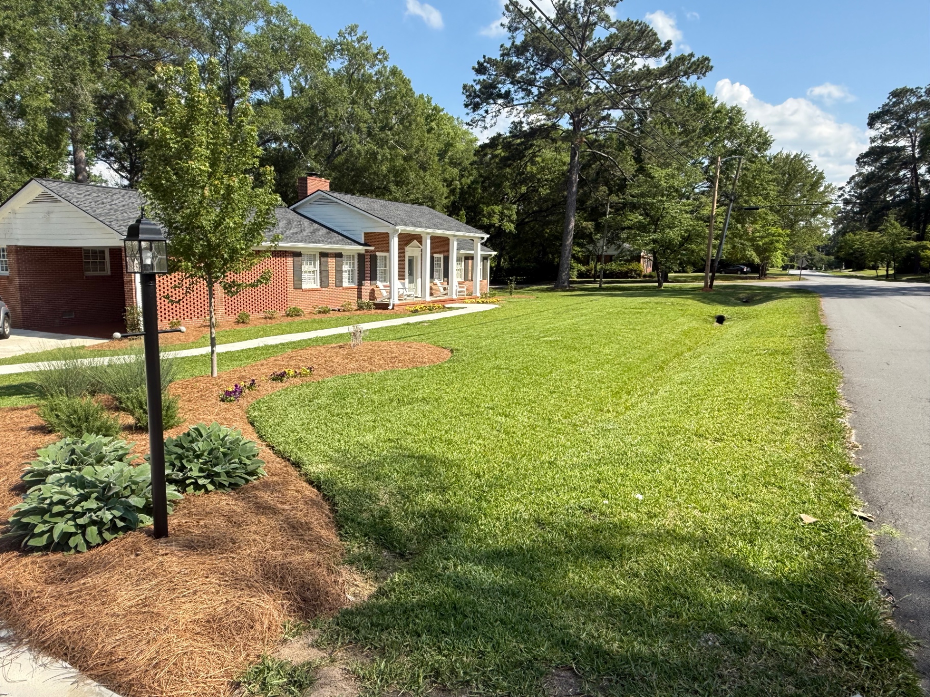 Edged front lawn with crisp mulch lines and trimmed grass