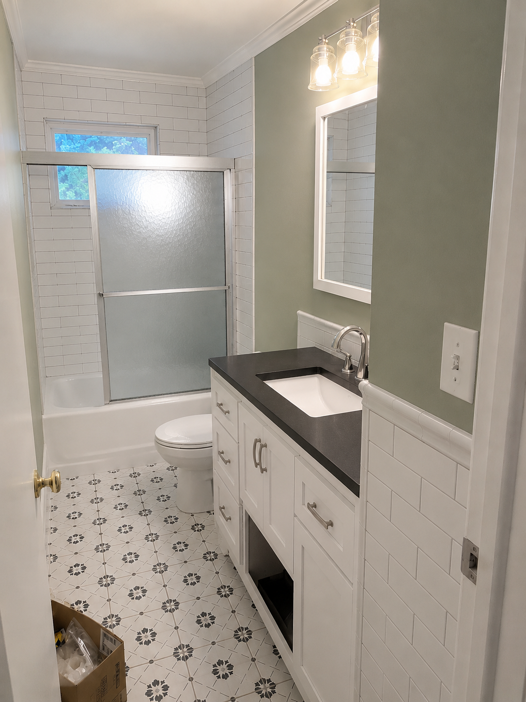 Same bathroom after wallpaper removal, fresh paint, and updated finishes